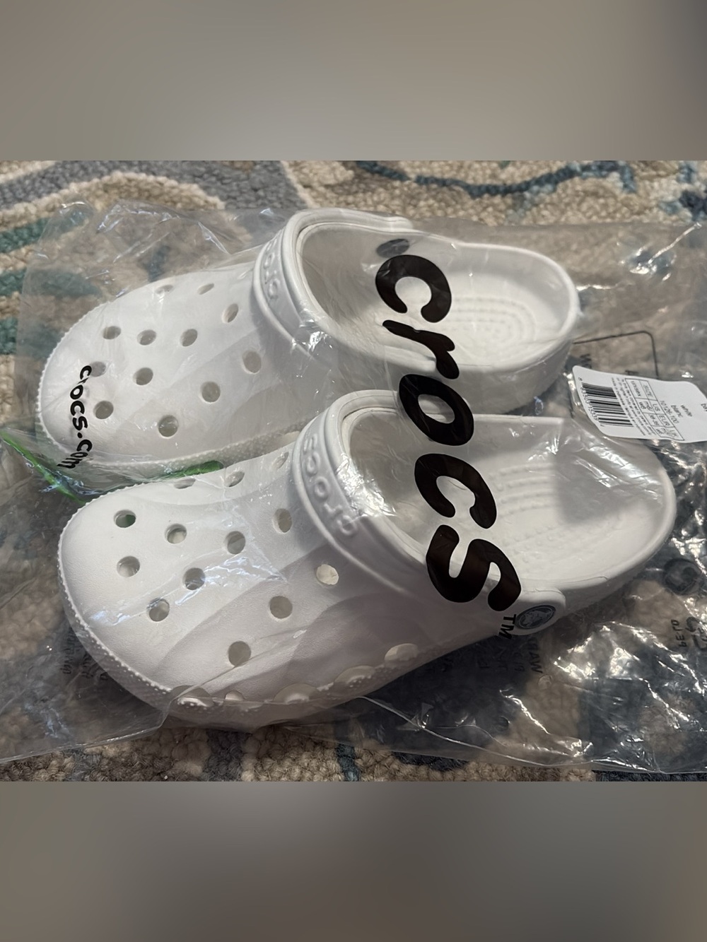Brand new White Crocs still in bag